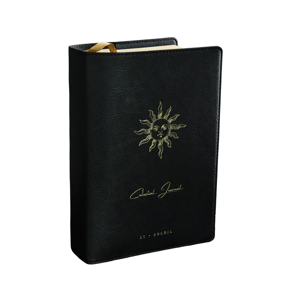 2026 celestial journal by St. Soleil | Black vegan leather journal with gold sun emblem and yellow interior 