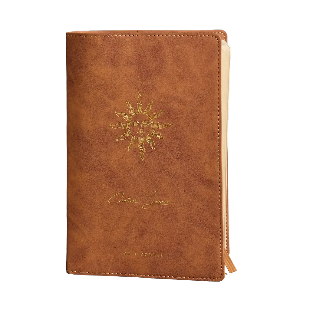 2026 celestial journal by St. Soleil | Brown vegan leather journal with gold sun emblem and yellow interior 