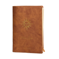 2026 celestial journal by St. Soleil | Brown vegan leather journal with gold sun emblem and yellow interior 