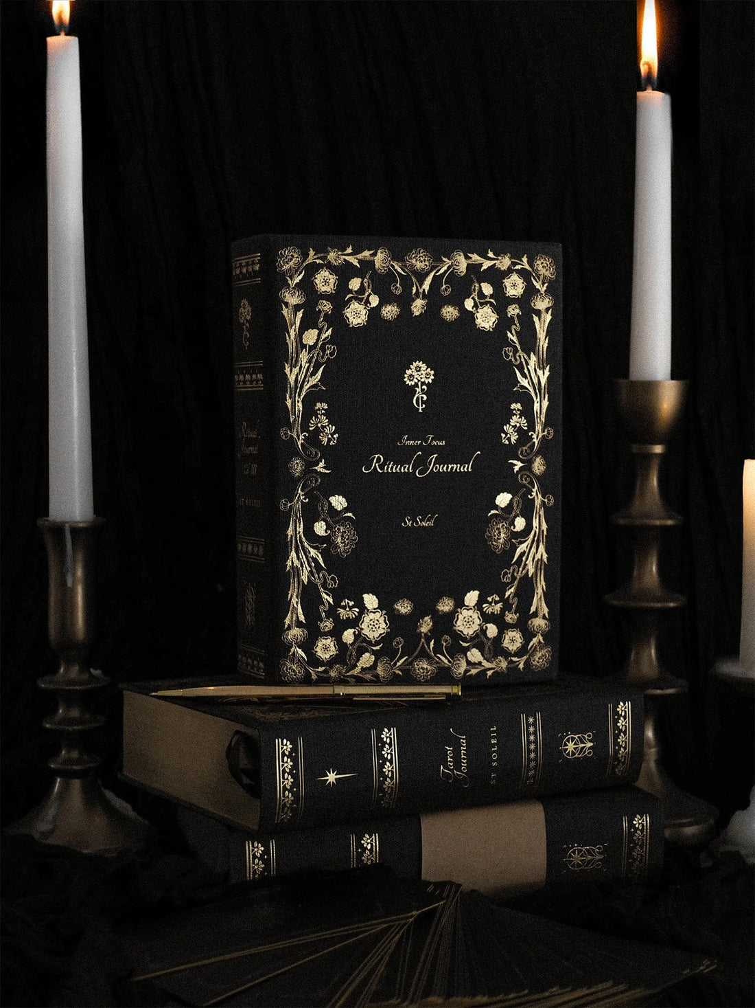 Decorative journal with gold floral design on a dark | Linen Ritual Journal