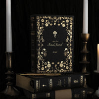Decorative journal with gold floral design on a dark | Linen Ritual Journal