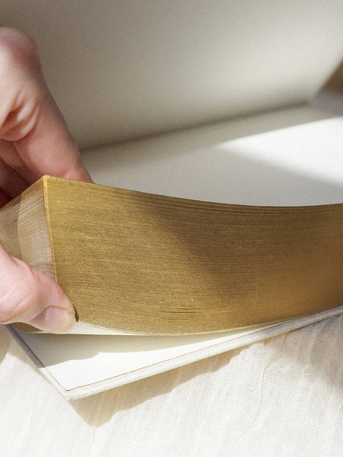 gold edges on beige linen journal