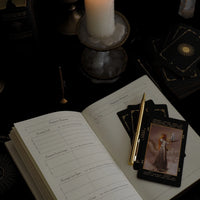 tarot journal preview with 3 tarot cards and pen
