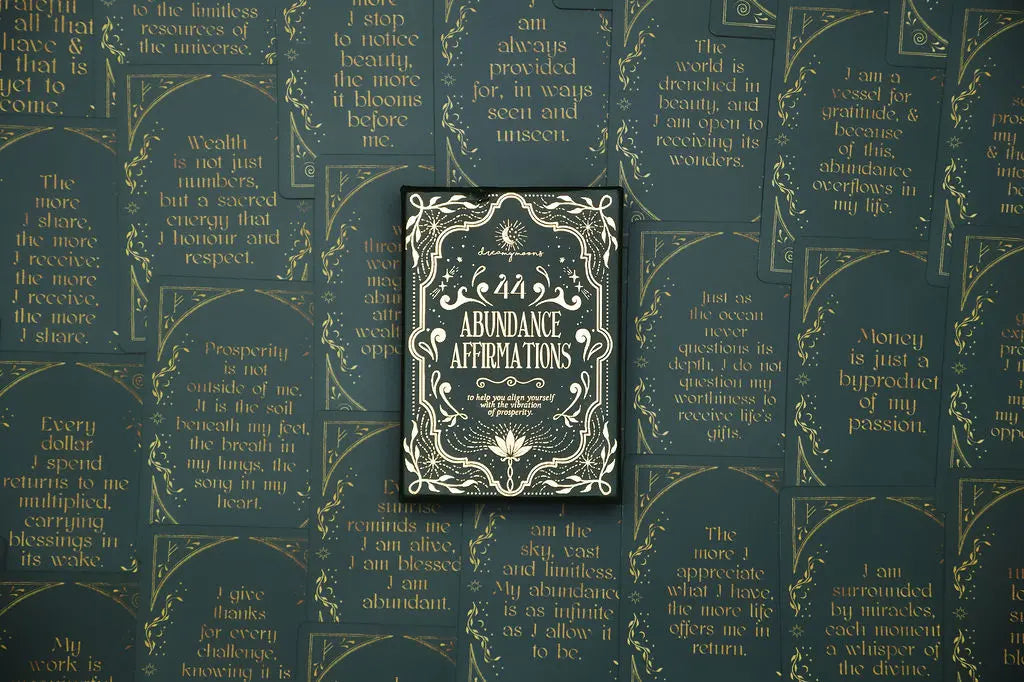 affirmation deck titled 'Abundance Affirmations' on a background with cards from the deck