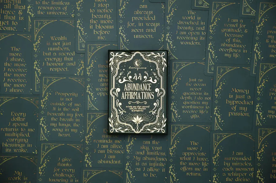 affirmation deck titled 'Abundance Affirmations' on a background with cards from the deck