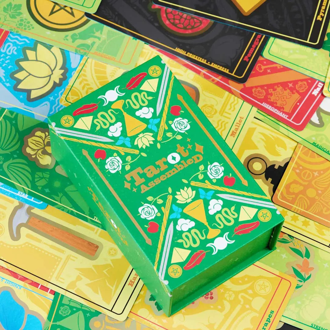 tarot assembled green box on top of oracle cards in deck