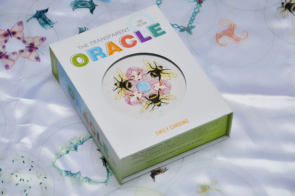 Box of 'The Transparent Oracle' cards with colorful design on a white background